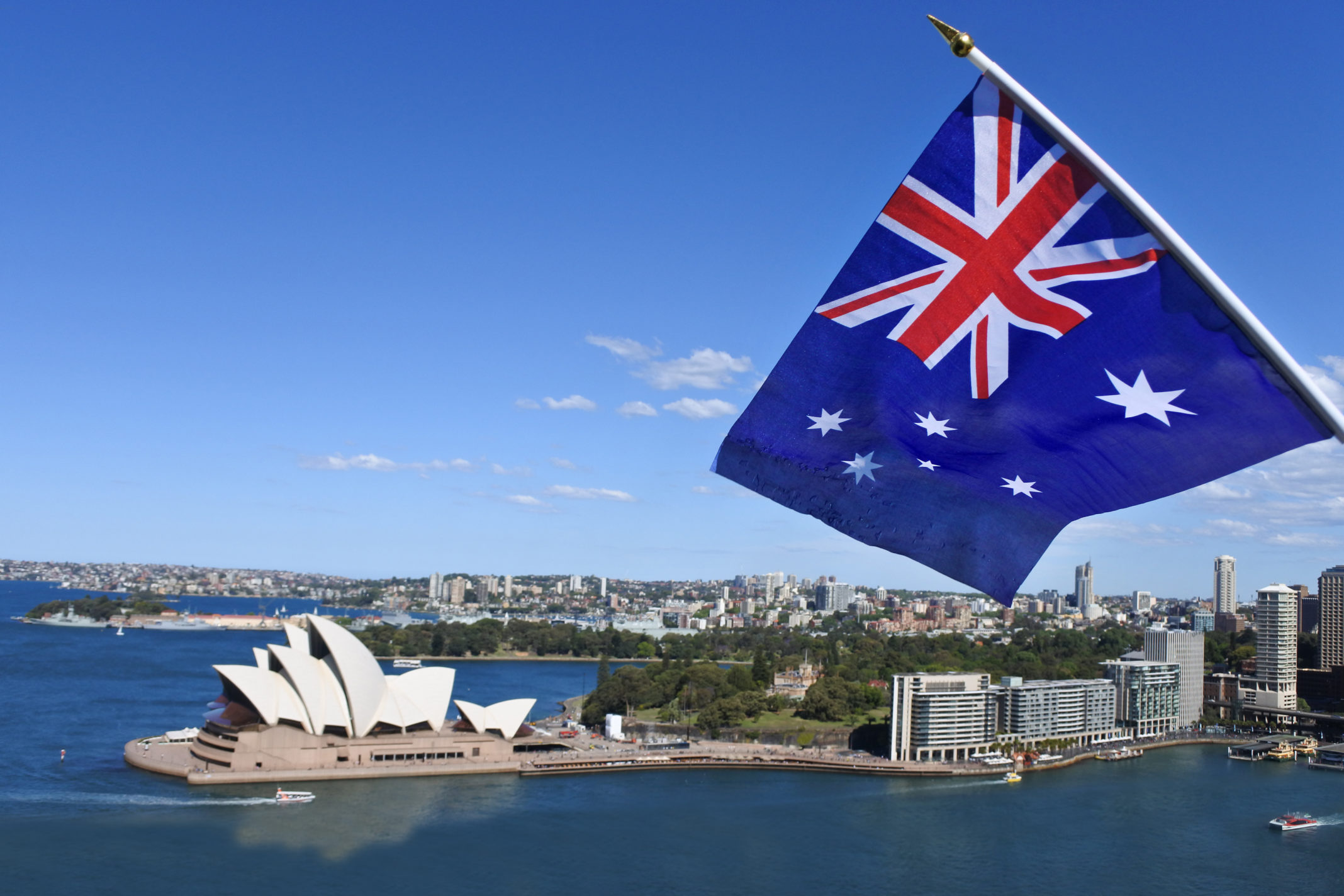 The,National,Flag,Of,Australia,Flies,Above,Sydney,Harbor,And